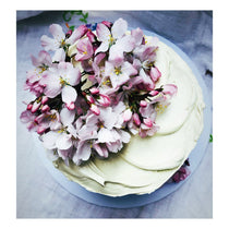 Gluten Free Pistachio, Almond & Lemon Curd Cake finished with seasonal flowers